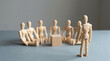 © Topa Studio - Business and entrepreneurship concept. Audience at the conference together. Wooden figures on grey background. (3)