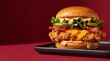 © zee - Crispy Fried Chicken Burger with Melted Cheese, Bacon, Lettuce, and Spicy Sauce on Black Plate, Dark Red Background Studio Food Photography Macro Shot