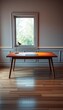 © Pimchada - Sleek wooden desk sits alone in the center of the room, beige, simple