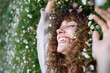 © Metadancer - White woman with curly hair smiling and lying