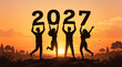 © waseemkhan - Silhouettes of people holding 2027 numbers on a hilltop at sunset symbolizing new year celebration and teamwork