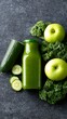 © decorator - Green juice bottle with cucumber kale and green apples on stone