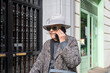 © GREGORIO - Senior woman talking on mobile phone in city