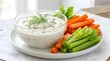 © JOHURAAKTER - Fresh creamy herb dip served with carrot and celery sticks