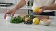 © Photo Moon - Food - Asian man cooking healthy meal with fresh salmon kale and blueberries