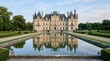 © Влада Яковенко - Elegant historic chateau reflected in a formal pool, luxury architectural landscape photography, symmetrical pale stone facade, manicured grounds, soft blue sky, calm water and premium heritage