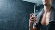 © 24DIY - Man spraying body spray after shower with sweat visible on chest Banner Promotion