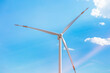 © ADDICTIVE STOCK - Wind turbine for renewable energy under blue sky
