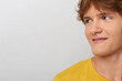 © SHOTPRIME STUDIO - A young man in a yellow shirt looks to the side with a thoughtful expression in a bright studio, conveying curiosity and mood.