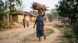 © SyedIstaqbal - Village woman carrying bundle of wood on head in rural settlement