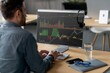 © Prostock-studio - Focused Man Analyzing Stock Market Data On Computer Screen While Working In Bright Modern Office Environment. Demonstrating Professional Engagement With Financial Information, Business Concept.