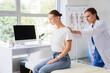 © Pixel-Shot - Physical therapy and posture correction, doctor examining patient shoulder pain and spinal alignment in medical clinic office for rehabilitation therapy