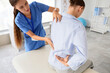 © Pixel-Shot - Physical therapy and back pain treatment, physiotherapist examining patient spine and lower back in medical clinic for rehabilitation and recovery