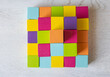 © Irina - Colorful wooden cubes arranged in neat square grid mosaic pattern