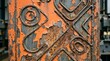 © Zaidi - Peeling orange paint reveals rust on weathered metal grate