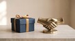 © DhimasPratama - blue gift box with golden ribbon next to a brass handshake sculpture business deal bonus and partnership rewards concept