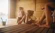 © Jacob Lund - Women relaxing in a sauna session for wellness and recovery