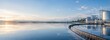 © pornthip - Industrial water treatment plant facility at sunset with scenic lake view and reflection