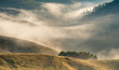 © Amazing Aerial - View of rolling hills covered in morning mist with patches of forest in the landscape of Alba Iulia, Alba County, Romania.