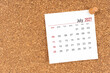 © Southtownboy Studio - White calendar sheet for July 2027 with thumbtack on board, Position with copy space.