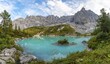 © Moritz Wolf/imageBROKER - Turquoise-green Sorapis Lake, Lago di Sorapis and mountain top Dito di Dio, Dolomites, Belluno, Italy