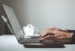 © MUNTHITA - Person hand typing password security login in laptop to access privacy profile on website, secure password for authorization system of technology concept. Cybersecurity, verification, authentication.