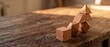 © Sabuj - Geometric clay blocks stacked into abstract structure on vintage wooden table surface.