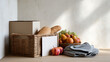 © visoot - Wicker basket bread apple fruit donation box grape napkin wooden table natural light healthy food