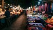 © Thares2020 - A bustling night market with colorful textiles  flowers  and illuminated stalls along a narrow walkway