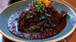 © Sky Layer - oaxacan mole negro turkey with dark sauce