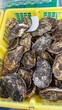 © Inha - Fresh oysters in a market crate ready for sale.