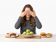 © Madhushan - Determined young woman refusing junk food sweets and maintaining healthy diet choices isolated on clean white background