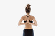 © Westend61 - Woman practices reverse prayer yoga pose indoors for flexibility