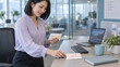 © Mariya Sorvacheva - Employee Writing Valentine Appreciation Card at Office Desk