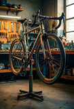 Bicycle maintenance and repair, road bike on a professional mechanic stand in a workshop for cycling service and tune up with tools on a pegboard wall