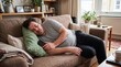 © SameleVisuals - Man sleeping on couch holding phone, tired, relaxed, comfortable, casual, home, lazy, resting, afternoon, indoors.