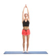 © New Africa - Young woman practicing yoga on fitness mat against white background