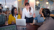 © CarlosBarquero - Professional businesswoman leading collaborative team meeting, diverse colleagues engaging in strategic brainstorming and sharing innovative ideas within modern office environment