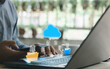 © MUNTHITA - Person using laptop with cloud upload and download icon, connected folder, secure data file, online storage, backup synchronization. Cloud computing file transfer, digital document management concept.