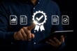 © Suni - Man touching a tablet screen displaying glowing quality assurance and document icons