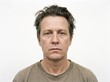 © Pathum Dilshan - Portrait of a mature man with messy hair looking at camera