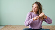 © VICHIZH - Teen Girl Brushing Tangled Damp Hair in Studio