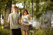 © ADDICTIVE STOCK - Children prepare barbecue skewers during family weekend outdoors
