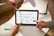 © Marc Tran/Stocksy - Brainstorming session with a tablet, mind map, and collaborative ideas