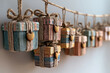 © Saman - Row of small wooden gift boxes hanging on a string against a soft wall