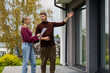 © ronstik - Real estate agent showing modern house to client. Realtor and customer inspecting property before buying