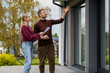 © ronstik - Real estate agent showing modern house to client. Realtor and customer inspecting property before buying