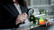 © InfiniteFlow - A business professional evaluates energy efficiency data using a modern digital interface, highlighting metrics and sustainability indicators for thoughtful corporate management decisions. Ledger