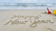 © Purple 1 - A beautiful beach scene welcomes the new year with a sandy message and ocean waves