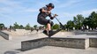 © Violet - Young boy performing a trick on a scooter in a skate park